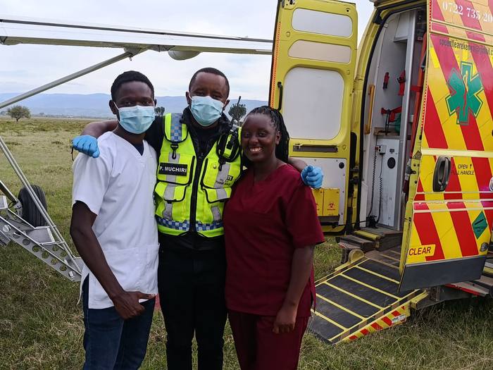 Crew and medical team at an airstrip